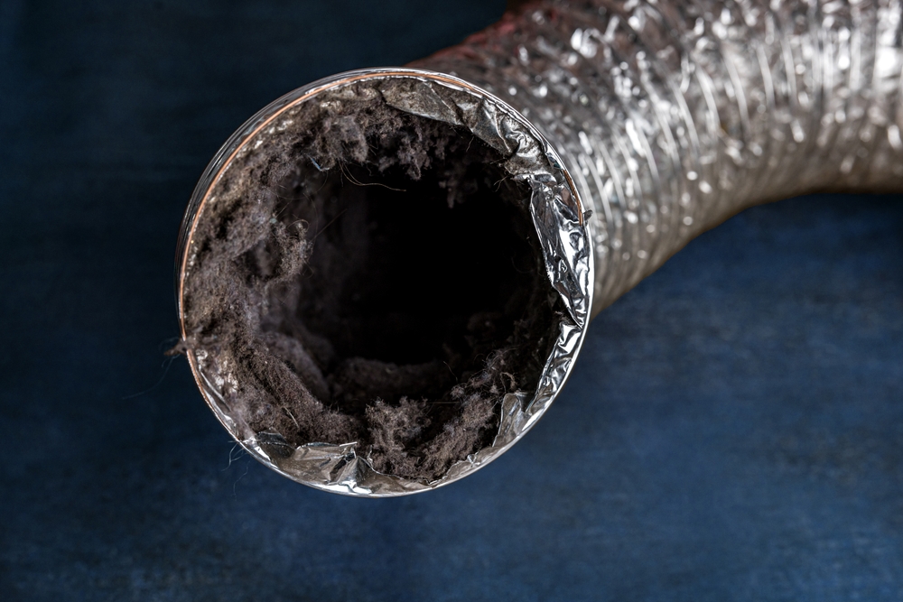 View of a clogged dryer vent that needs immediate dryer vent cleaning.