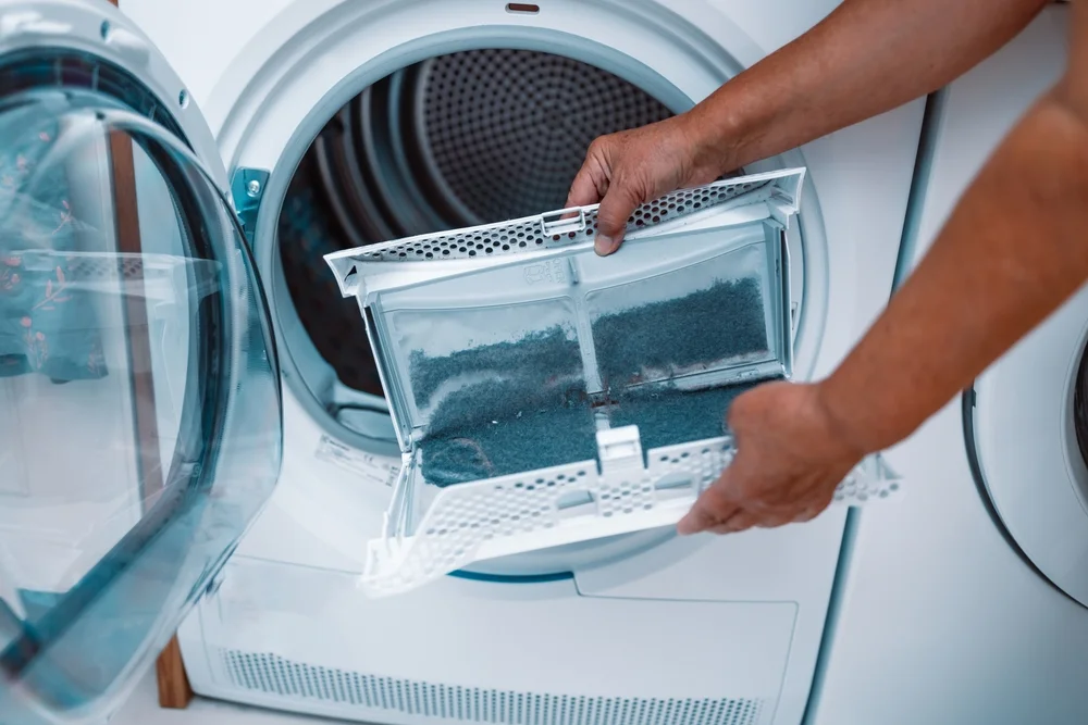 View of intense lint build-up on a home clothes dryer which requires immediate dryer vent cleaning.