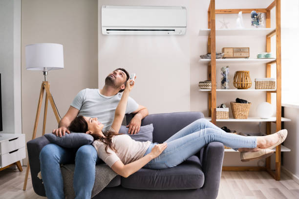 Image of couple enjoying a cool inddor air environment provided by a new hvac systen insyallation in Kissimmee Fl