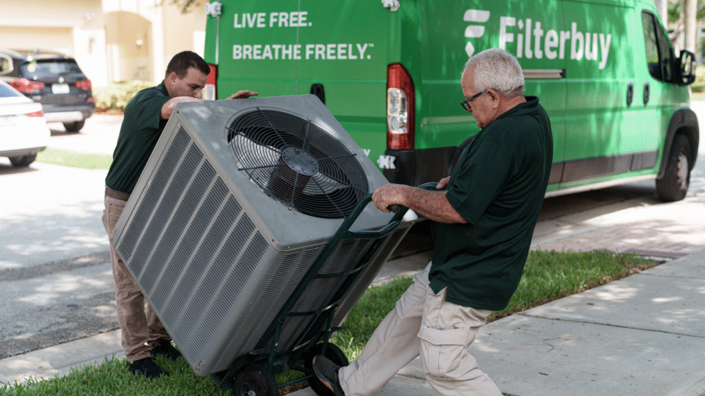 2 persons installing central heat and air